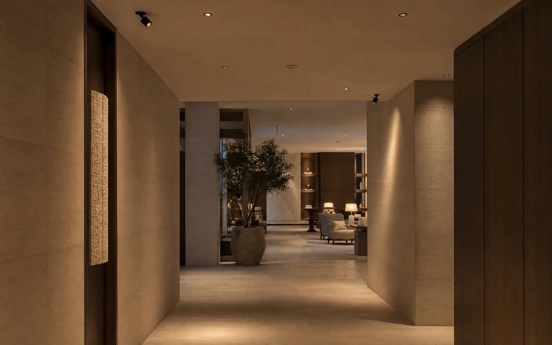 Hospitality corridor and lounge with recessed downlights and adjustable spotlights